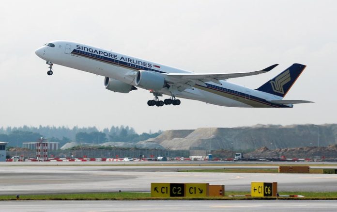 FILE PHOTO: A Singapore Airlines Airbus A350 plane takes off at Changi Airport in Singapore
